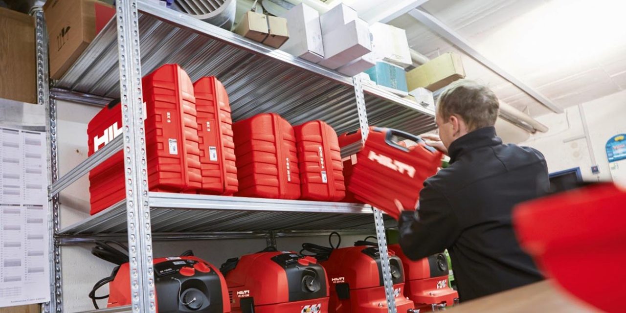 a tool crib manager takes a Hilti tool off of a shelf