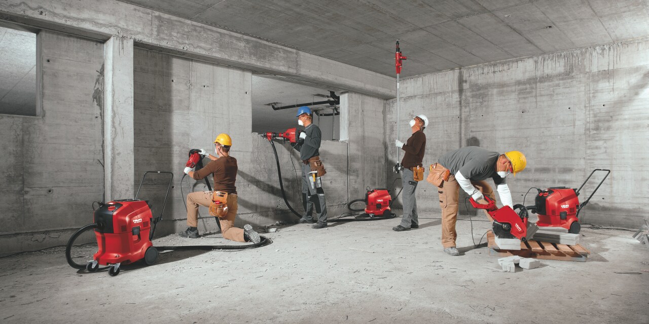 Image of all the full portfolio of Hilti vacuum cleaners being used on the construction site
