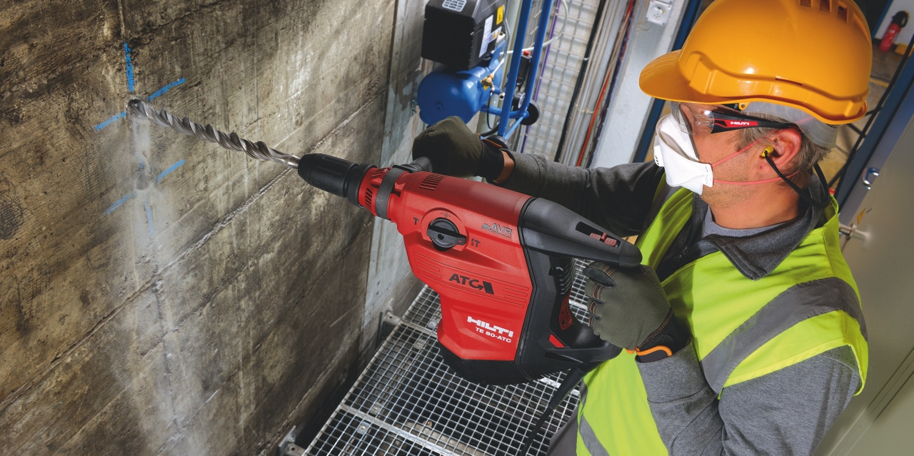 Construction worker using a TE 80-ATC/AVR Corded combihammer with Active Torque Control (ATC) to help prevent kickback